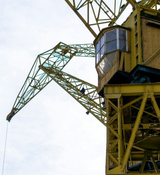 a large crane is attached to the side of a building